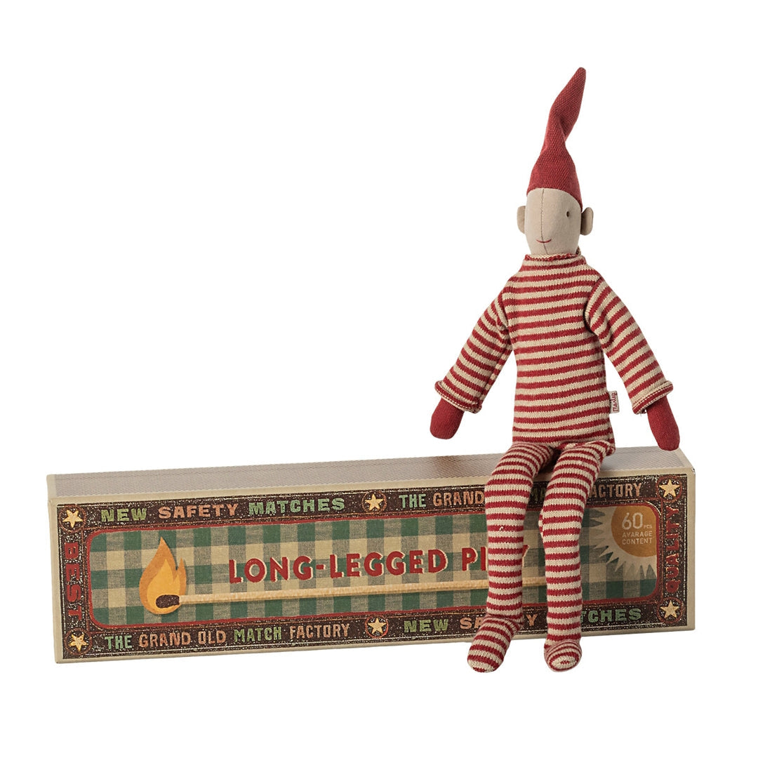 Maileg Pixy Elf sitting on matchbox showing long legs and knitted red suit - magnetic hands