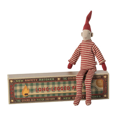 Maileg Pixy Elf sitting on matchbox showing long legs and knitted red suit - magnetic hands