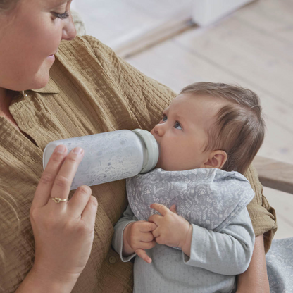 Elodie Glass Feeding Bottle Lifestyle - Baby Drinking from Anti-Colic Glass Bottle 0-6 Months